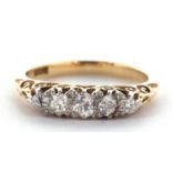 An 18ct five stone diamond ring, the five graduated old round brilliant cut diamonds, set with