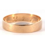 A yellow metal wedding ring of plain polished design engraved inside with a D.B 2.4.18, tests 9ct