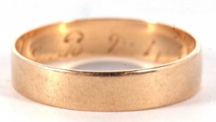 A yellow metal wedding ring of plain polished design engraved inside with a D.B 2.4.18, tests 9ct