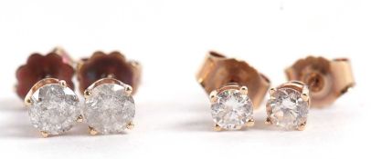Two pairs of diamond earstuds, the first approx. 0.40cts each, claw mounted with posts and screw