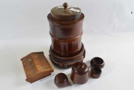 Mixed Lot: Cylindrical wooden box and cover with a hardwood stand, two further small wooden boxes
