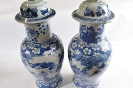 A large pair of 19th Century Chinese porcelain vases and covers decorated in Kangxi style with