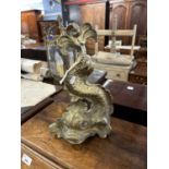 19th Century brass door stop in the form of a classical dolphin, 34cm high