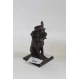 A cast metal model of Punch's dog with indistinct mark to base