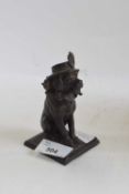 A cast metal model of Punch's dog with indistinct mark to base