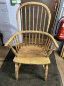 A 19th Century elm seated stick back Windsor chair raised on turned legs with a central H stretcher,