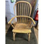 A 19th Century elm seated stick back Windsor chair raised on turned legs with a central H stretcher,