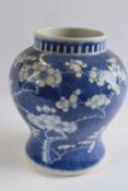 Chinese porcelain ginger jar, the blue ground with prunus decoration and four character mark to base