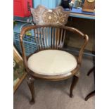 A Edwardian mahogany framed bow back armchair with upholstered seat and cabriole legs