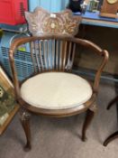 A Edwardian mahogany framed bow back armchair with upholstered seat and cabriole legs