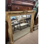 A large 19th Century gilt over mantel mirror with foliate moulded detail, 134cm x 120cm