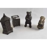 A collection of four late 19th/early 20th Century metal money boxes, some with registered design