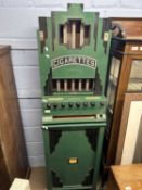 Rowe, New York, USA, a vintage cigarette dispensing machine in floor standing green and black