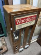 A vintage Woodbine wall mounted cigarette dispenser, 67cm high