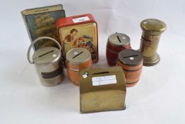 A collection of various vintage tin money boxes, eight in total