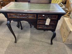 Late 19th Century writing table with four drawers raised on cabriole legs, the top inset with a