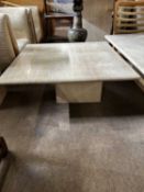 A modern marble coffee table, 79cm square top raised on a pedestal base