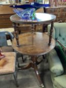 19th Century circular two tiered dumb waiter raised on a turned column and tripod base with casters,