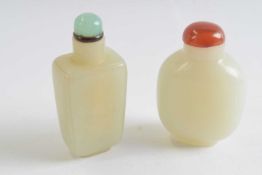 Small plastic bag with two jadeite snuff bottles with tops