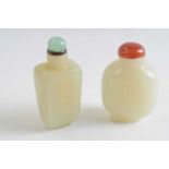 Small plastic bag with two jadeite snuff bottles with tops