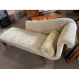 19th Century chaise longue with contemporary upholstery raised on turned legs with brass casters,