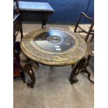 20th Century Indian hardwood circular occasional table decorated with carved floral detail and