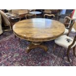 19th Century rosewood circular pedestal dining table raised on a tapering column with four