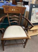 An Edwardian mahogany and inlaid bar back armchair with upholstered seat