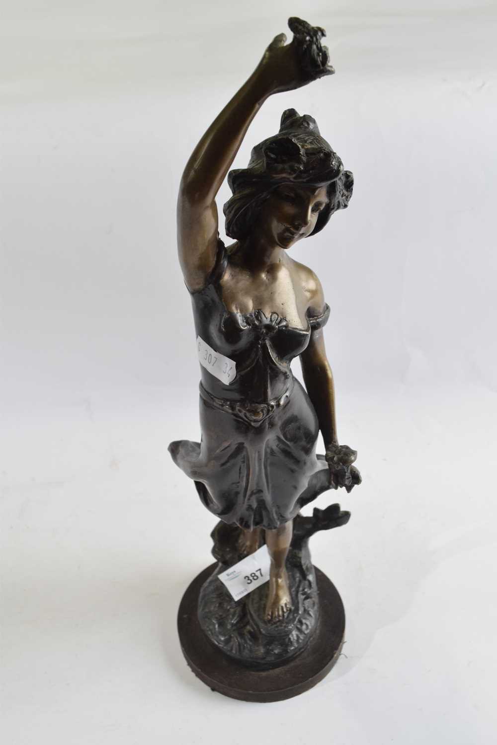 A Spelter figure of an Art Nouveau lady, 36cm high, signed by E Guillemin