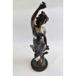 A Spelter figure of an Art Nouveau lady, 36cm high, signed by E Guillemin