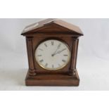Mantel clock with white enamel dial and black Roman numeral face