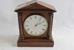 Mantel clock with white enamel dial and black Roman numeral face