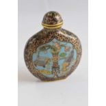 A Chinese Cloisonne scent bottle and cover of compressed ovoid form with a central panel of