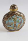 A Chinese Cloisonne scent bottle and cover of compressed ovoid form with a central panel of