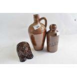 A ginger beer bottle Bourne Denby marked Caley together with a stoneware flask and a treacle