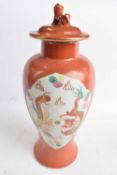 Chinese porcelain baluster vase and cover with dog of fo finial, the orange ground with gilt