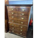 A Georgian mahogany chest on chest, the top section with moulded and dental cornice with two short