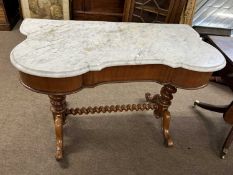 A Victorian marble top and mahogany framed wash stand, the shaped top supported on two barley