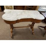 A Victorian marble top and mahogany framed wash stand, the shaped top supported on two barley