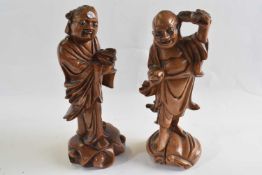 Two carved wooden models of Holti, 21cm high