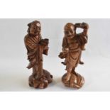 Two carved wooden models of Holti, 21cm high