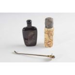Plastic bag containing two snuff bottle, one carved Japanese example with figures and silver top,