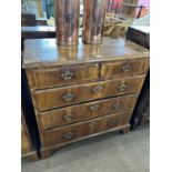 A George II walnut chest of two short over three long drawers raised on bracket feet, 95cm wide