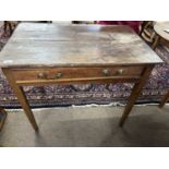 A Georgian oak single drawer side table fitted with brass swan neck handles and raised on tapering