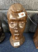 Two carved African busts, one in a black ebony wood the other in a light oak, largest 28cm