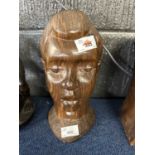 Two carved African busts, one in a black ebony wood the other in a light oak, largest 28cm