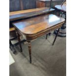 A 19th Century mahogany folding tea table raised on turned legs, 92cm wide