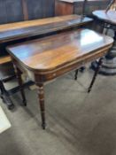 A 19th Century mahogany folding tea table raised on turned legs, 92cm wide