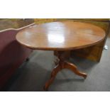 A 19th Century cherry pedestal supper table with circular top raised on turned column with tripod