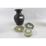 A Wedgwood basalt black baluster vase together with two green jasper ware items and a further